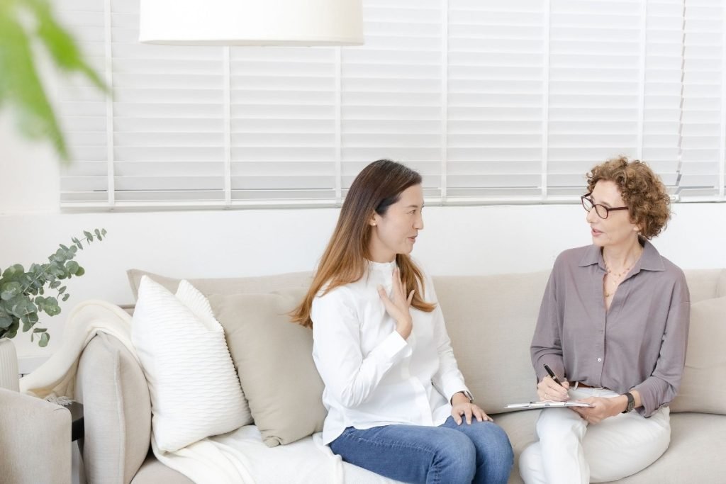 A nurturing consultation with a client, highlighting professional decluttering services in Singapore for neurodiverse women